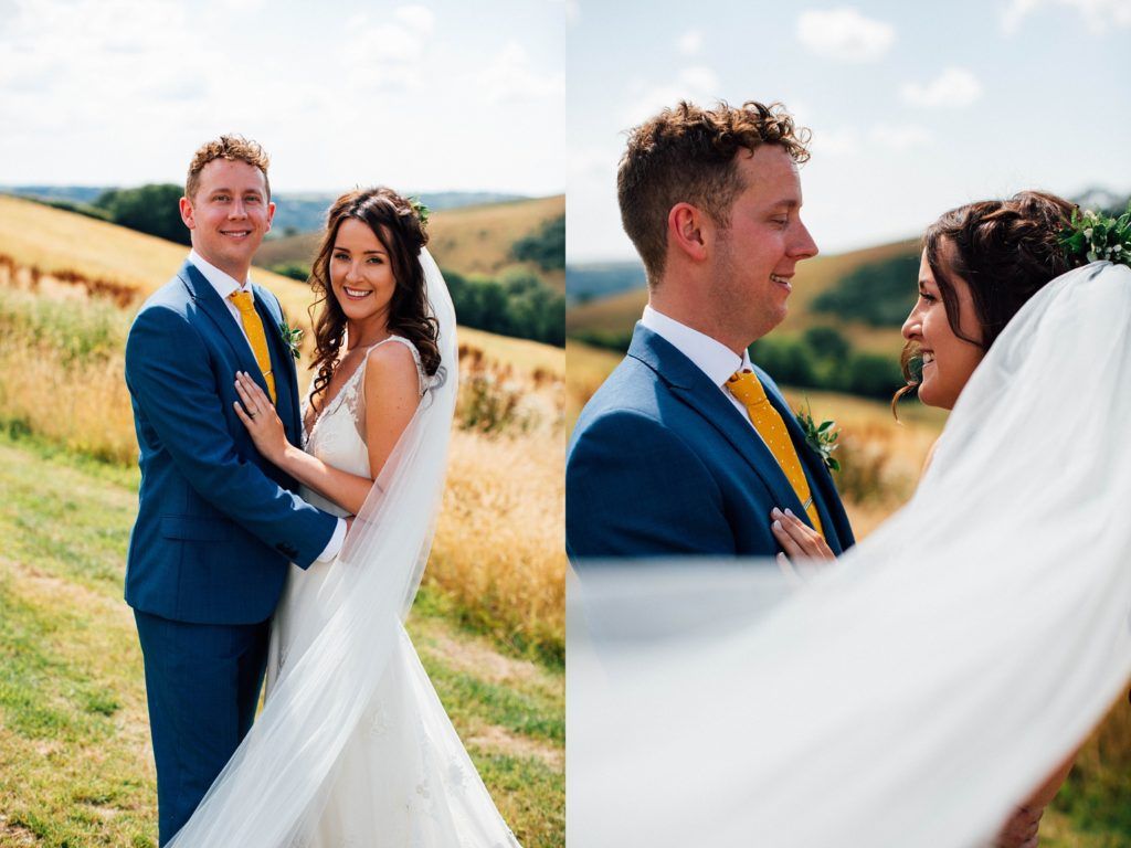Romantic wedding couple poses in golden field during sunset photoshoot.