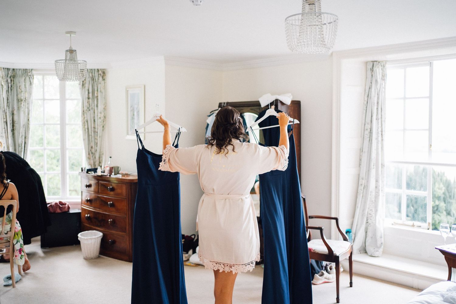 Getting ready sequence showing dress preparations in a sunlit room.