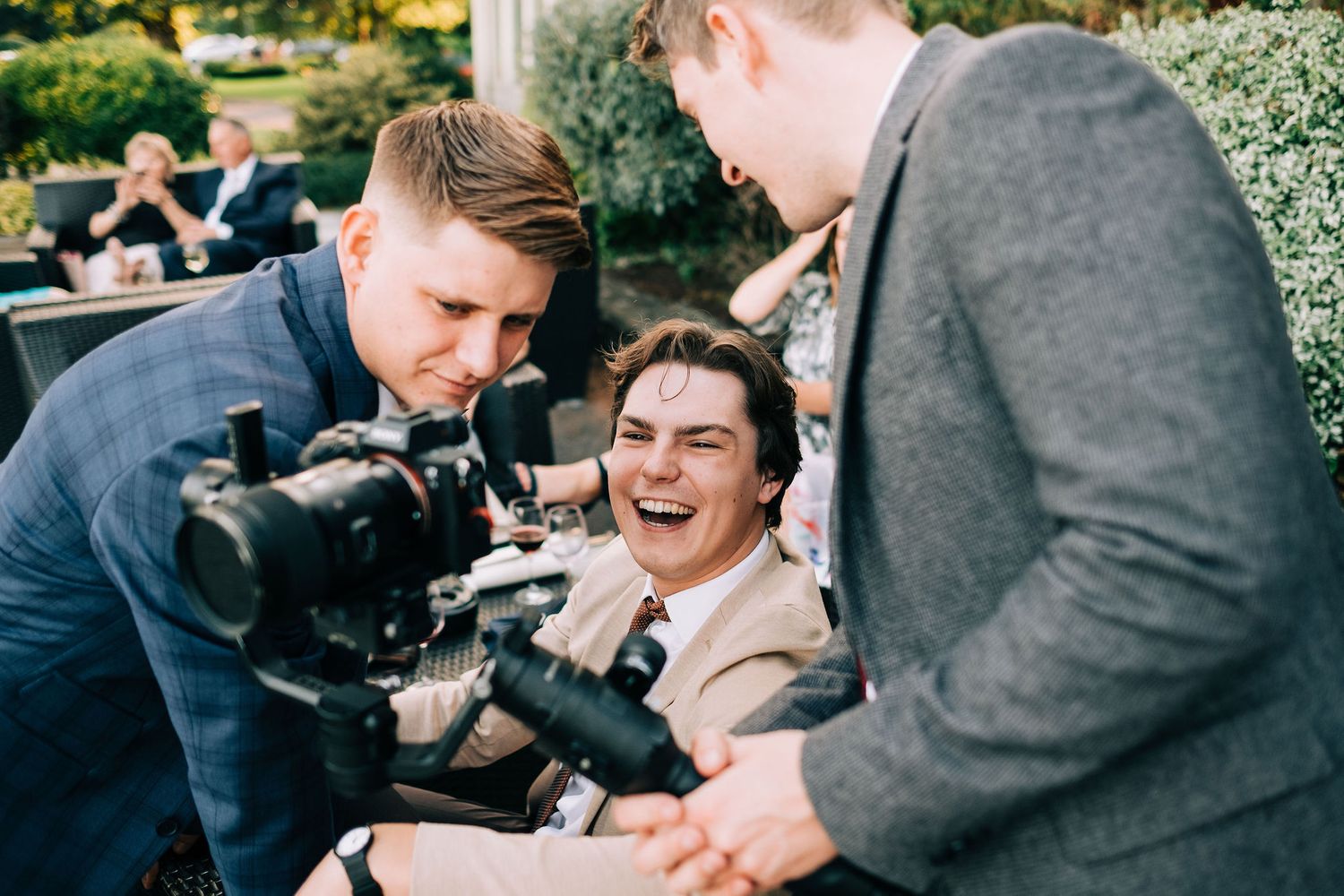 Candid moments of laughter and joy captured during outdoor wedding photography session.