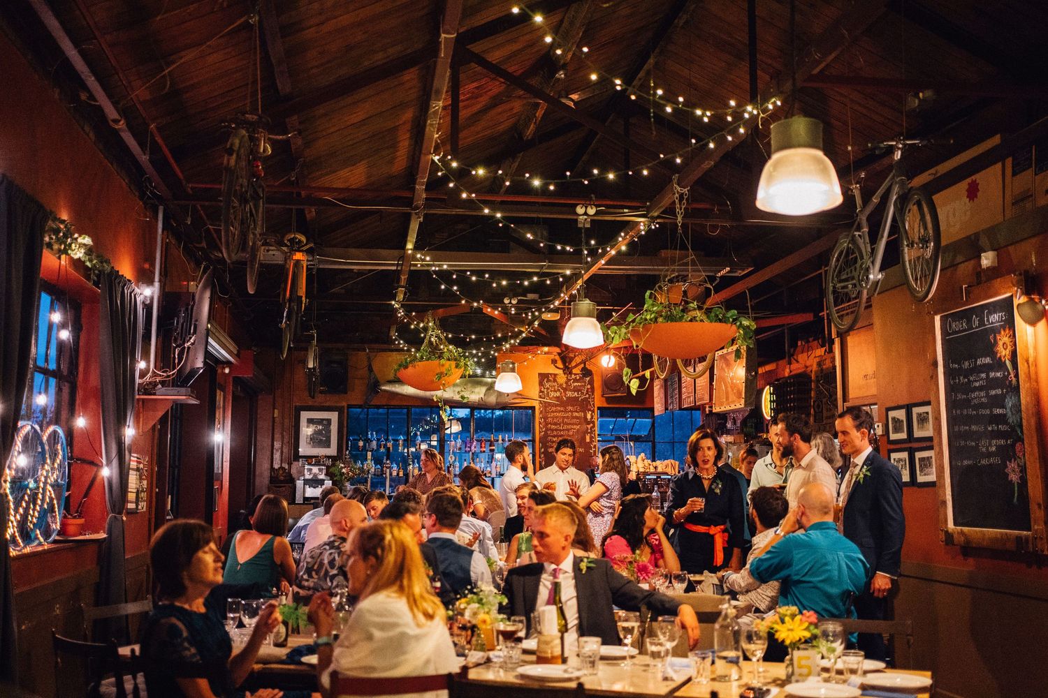 Dimly lit restaurant interior with string lights creating a cozy ambiance.