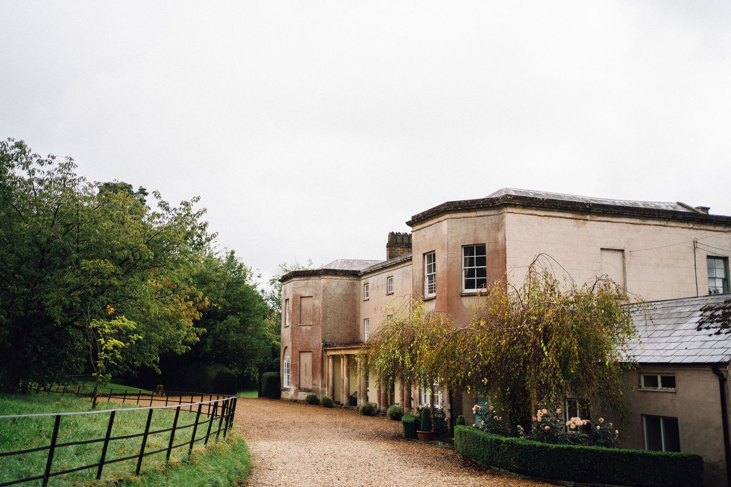Panoramic view of a countryside venue building with surrounding landscape.