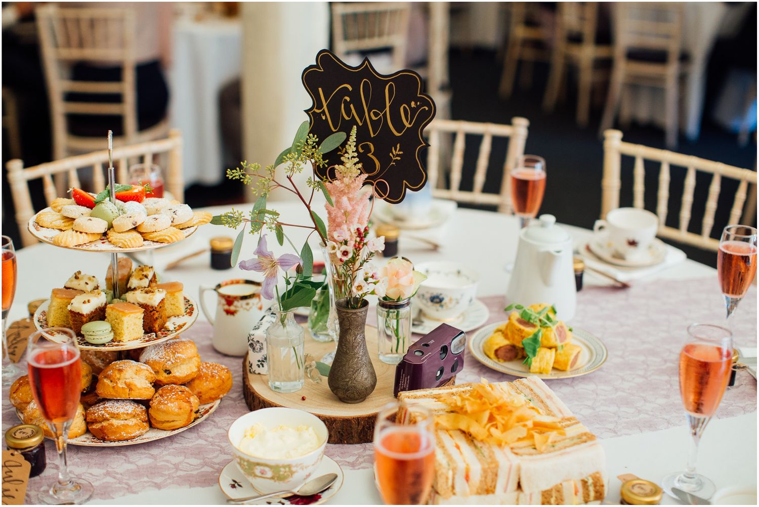 Wedding reception table set with appetizers and drinks.