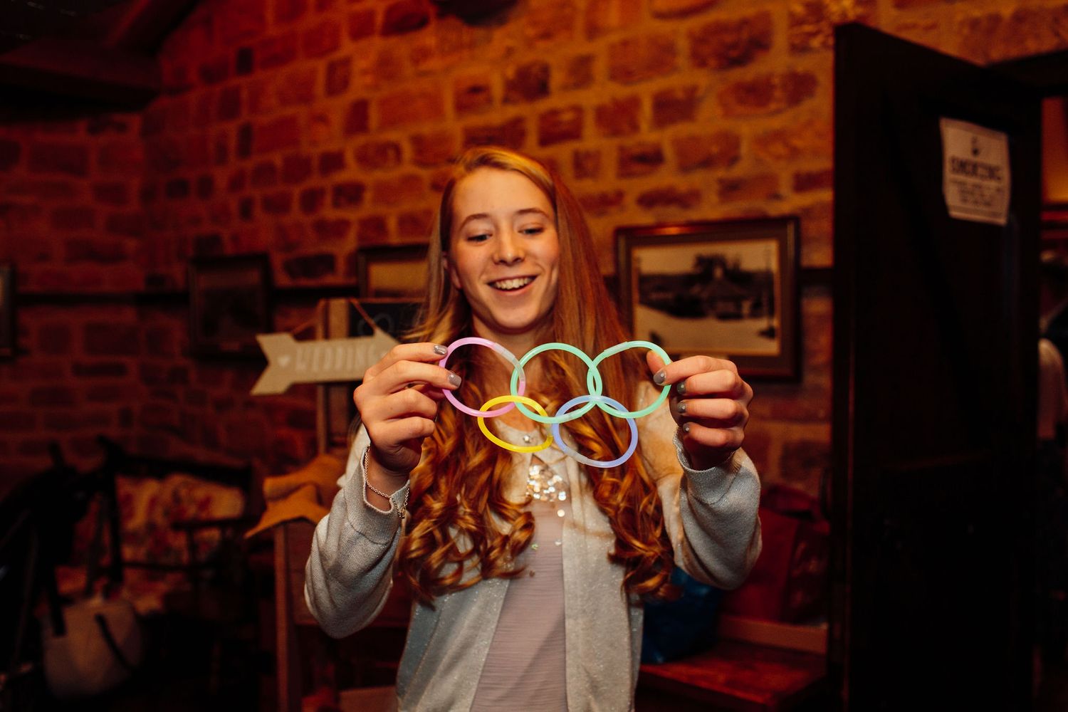 Guests playing with bubble wands during an indoor wedding reception.