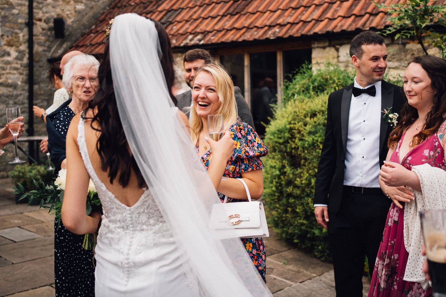 Wedding celebration candid moments outside a charming countryside venue.