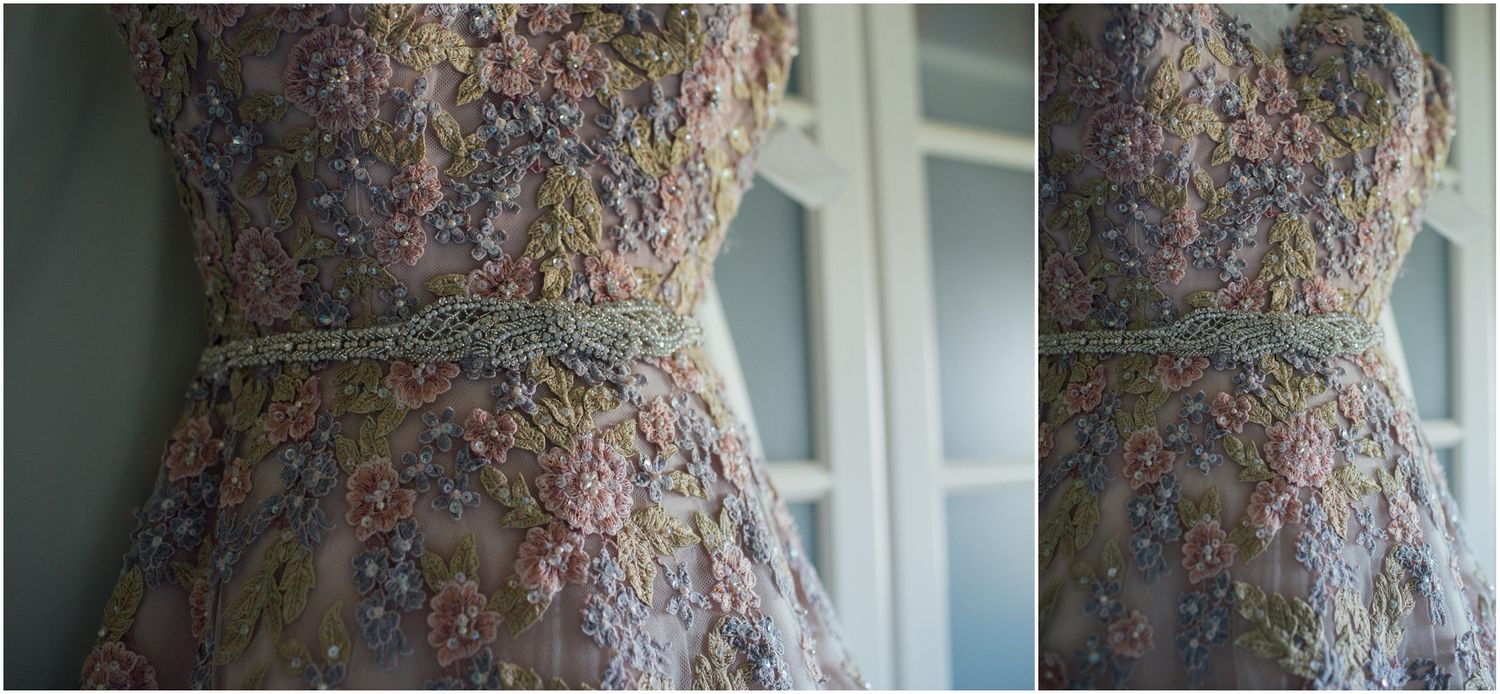 Close-up view of decorative wallpaper with floral patterns near a window.