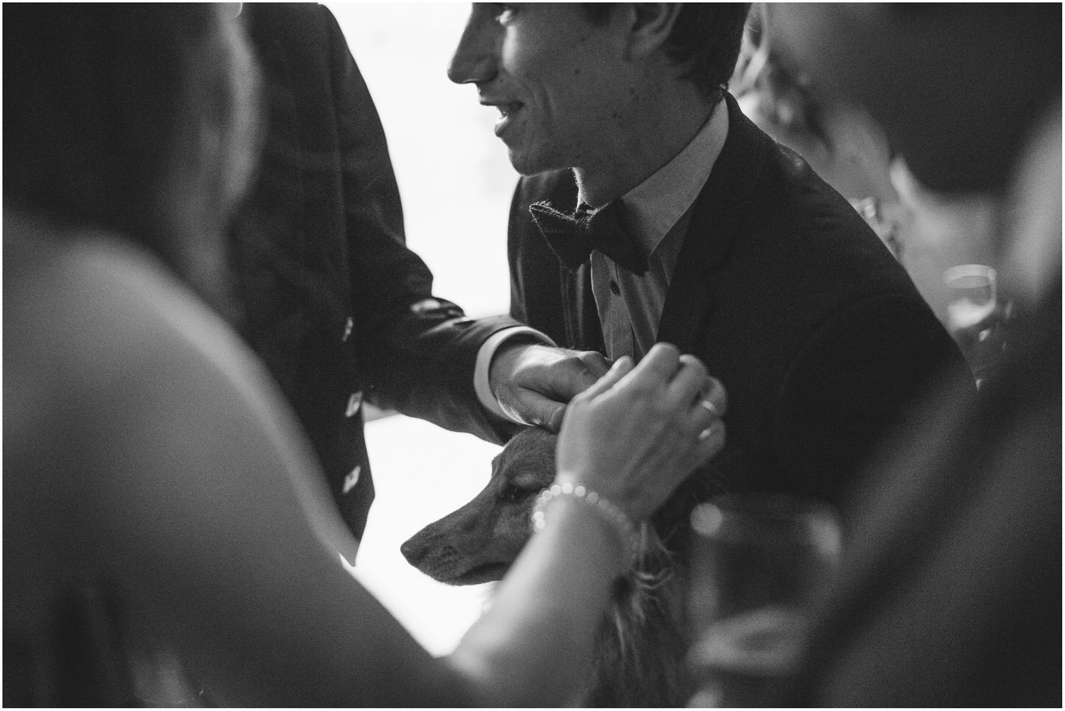Black and white candid moments from an indoor wedding ceremony.