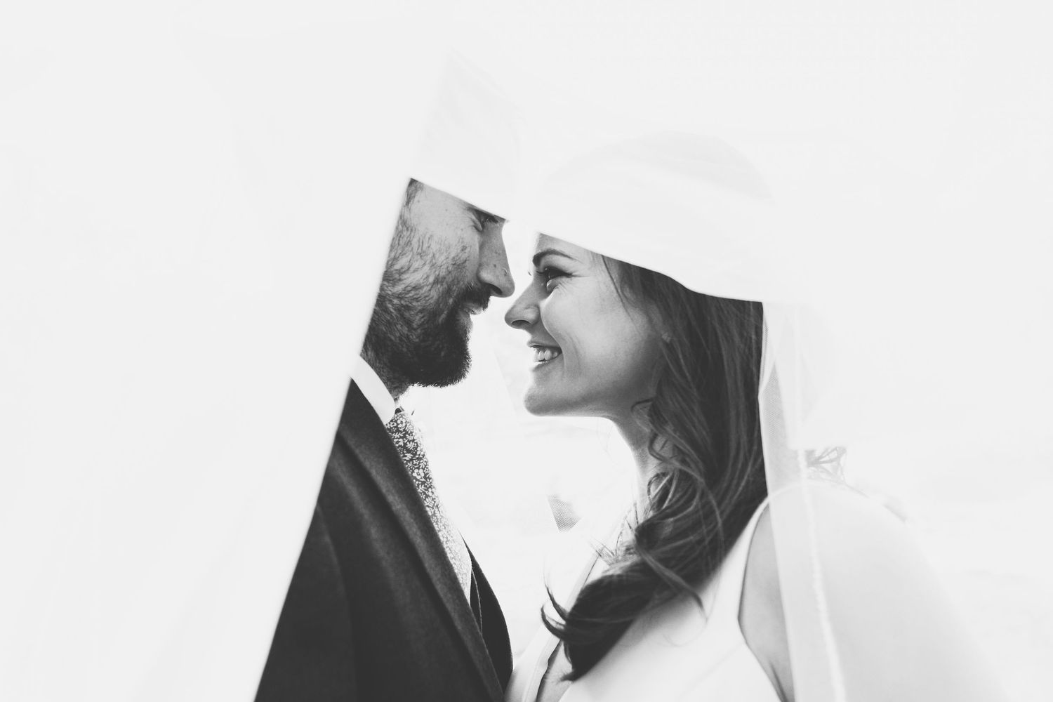 A romantic black and white wedding photography collage showing intimate moments between couples.