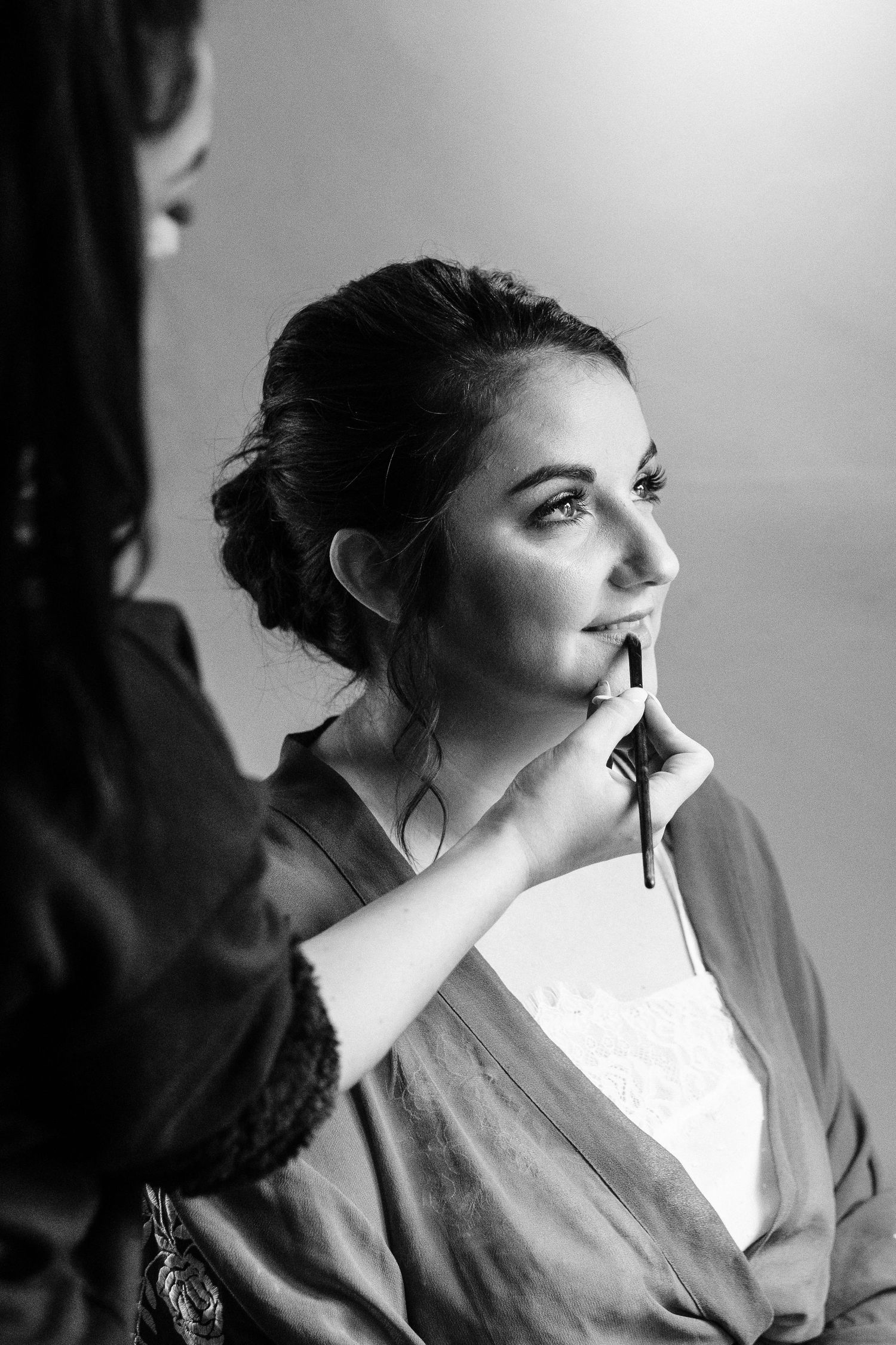 Artistic black and white portrait in natural window light.