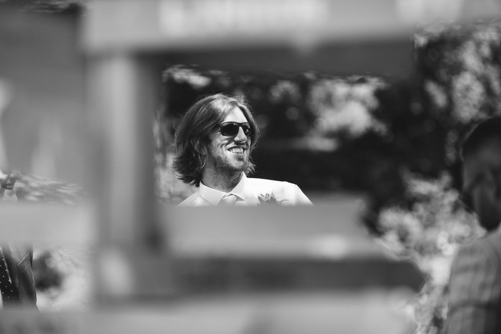 Candid black and white shots of wedding preparation moments.