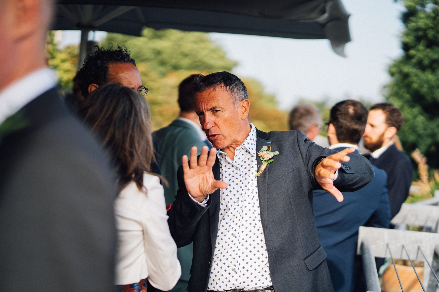 Wedding guests socializing during an outdoor summer reception.