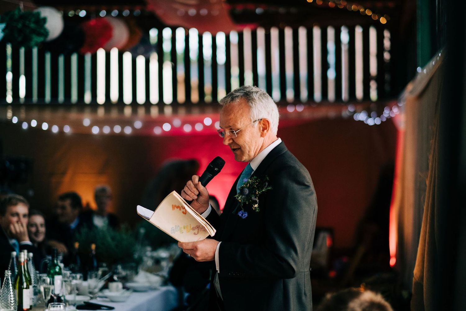Ambient lighting creates a warm atmosphere at an evening reception venue.