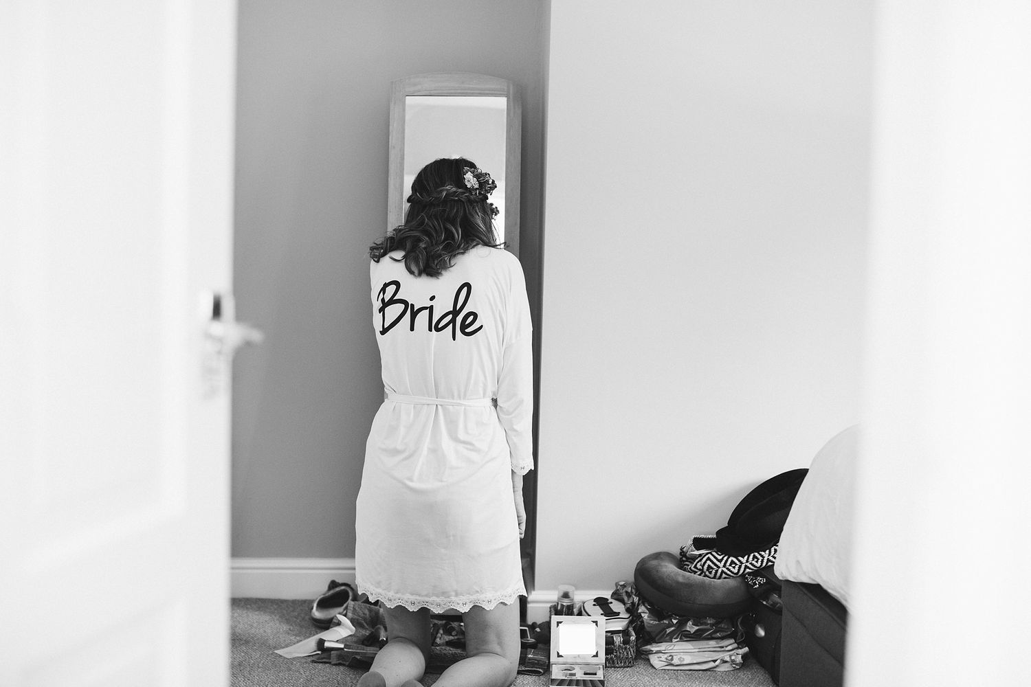 Wedding preparation scene with bridal accessories and natural lighting.