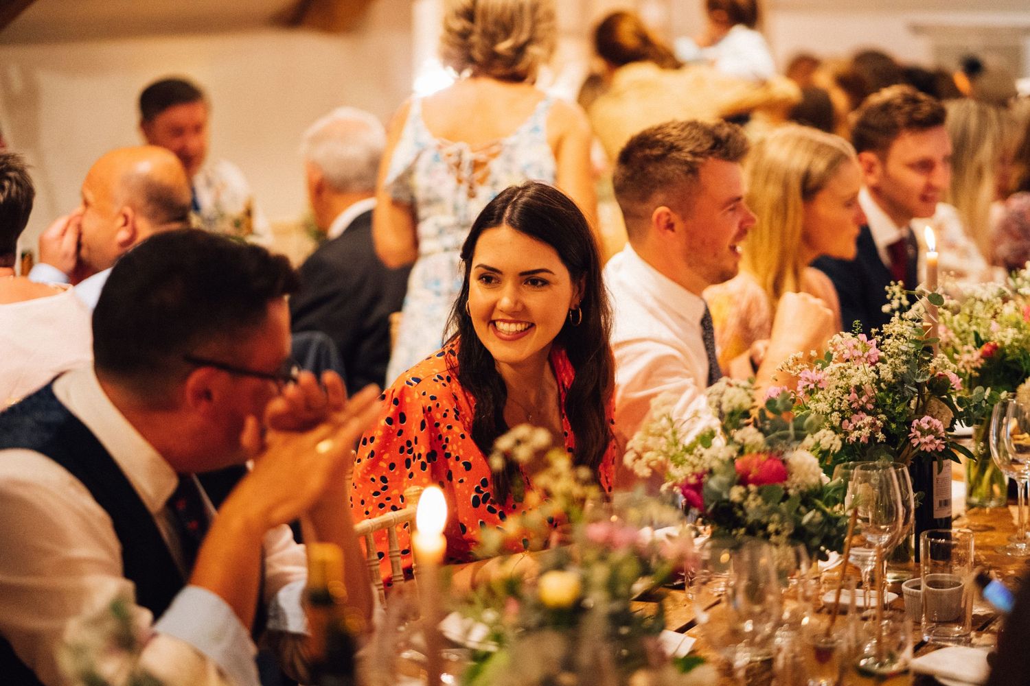 Candlelit reception dinner with guests enjoying the festive atmosphere.