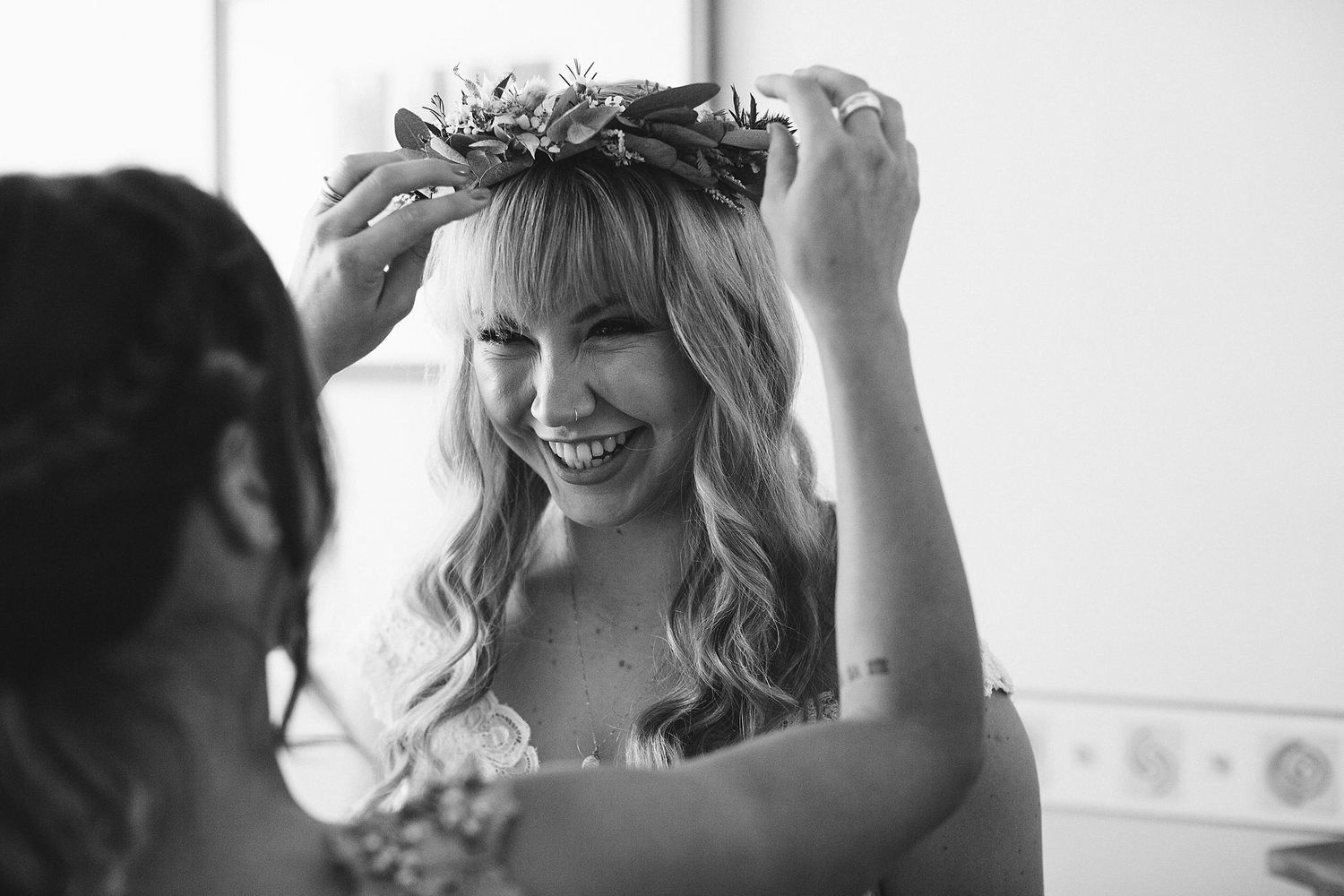 Black and white portraits showing someone wearing a delicate floral crown.