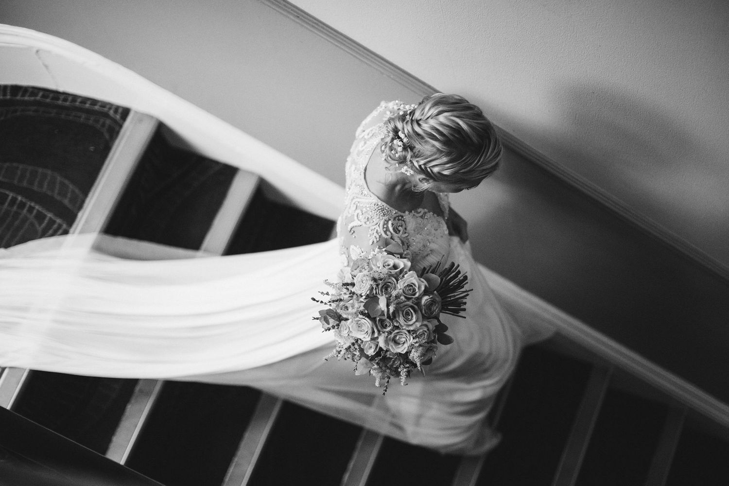 Artistic black and white wedding detail shots with veil and flowers.