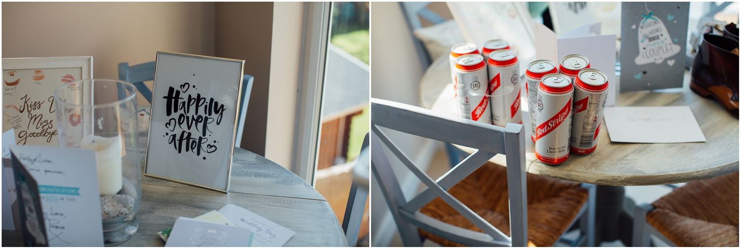 Wedding details including guest book and decorative gift boxes on display table.