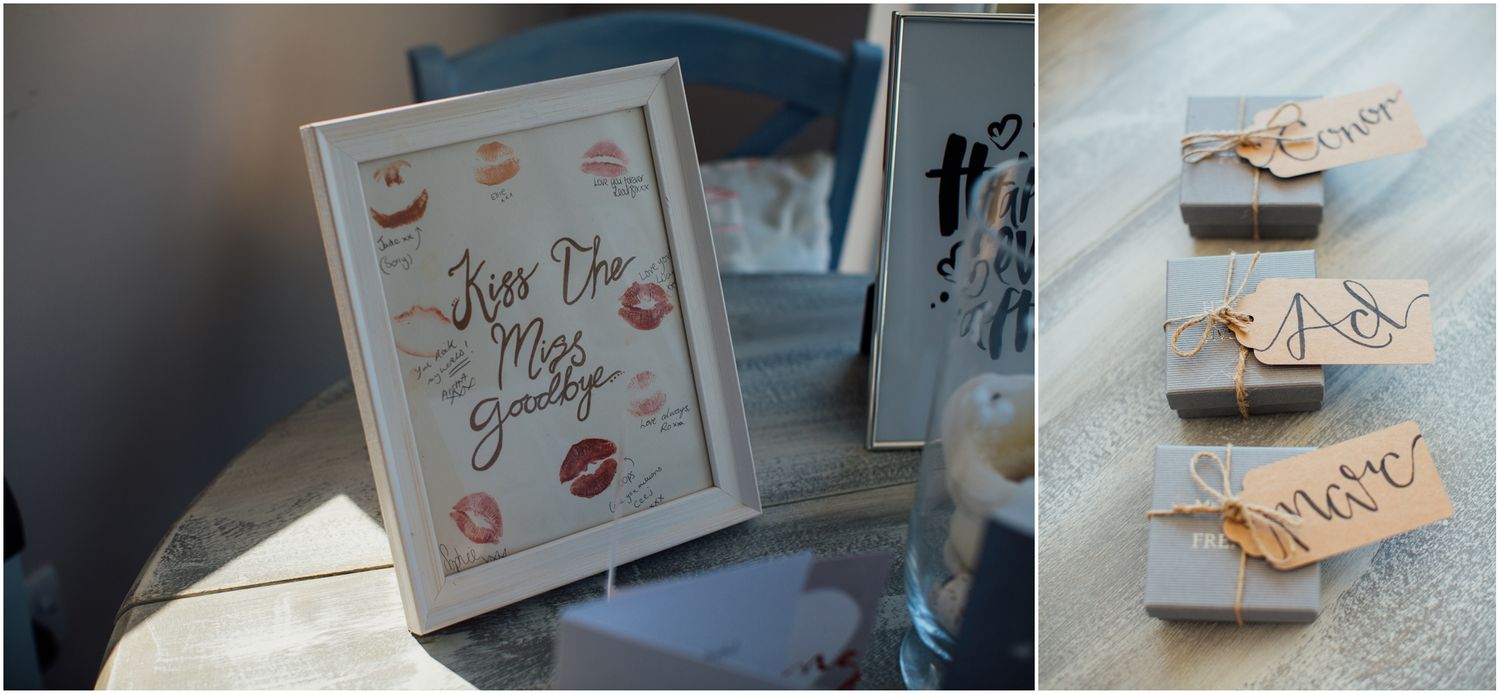 Wedding decor featuring framed kiss print artwork and decorative shoes.