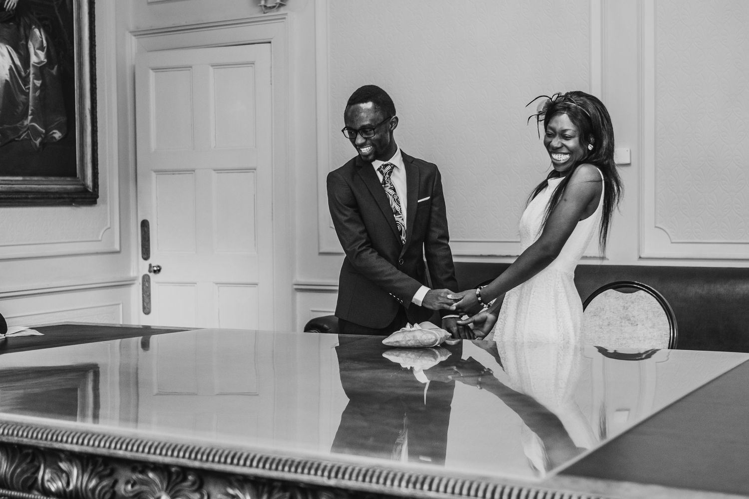 Black and white photos of elegant wedding moments in a classic interior setting.