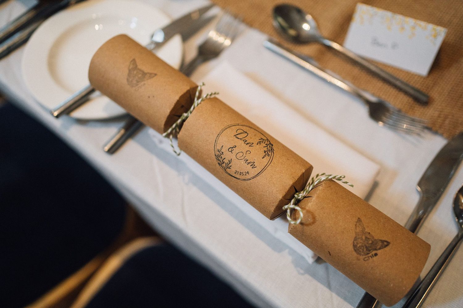 Vintage-style paper scrolls and calligraphy materials laid out on a wooden table.