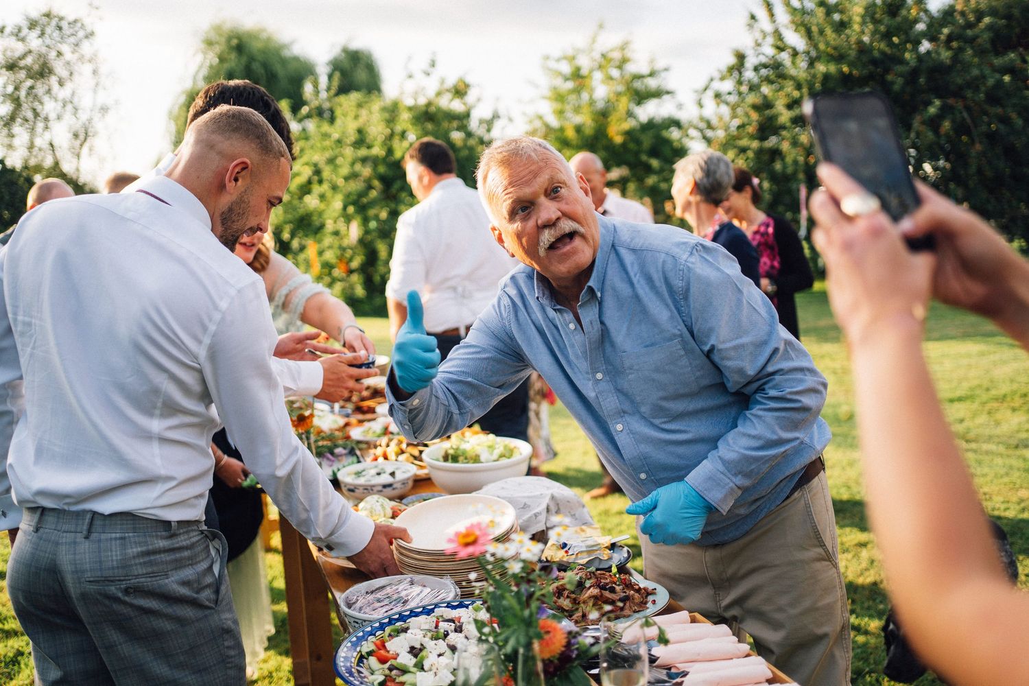 A series of outdoor party scenes showing people enjoying food and drinks at a casual garden gathering.