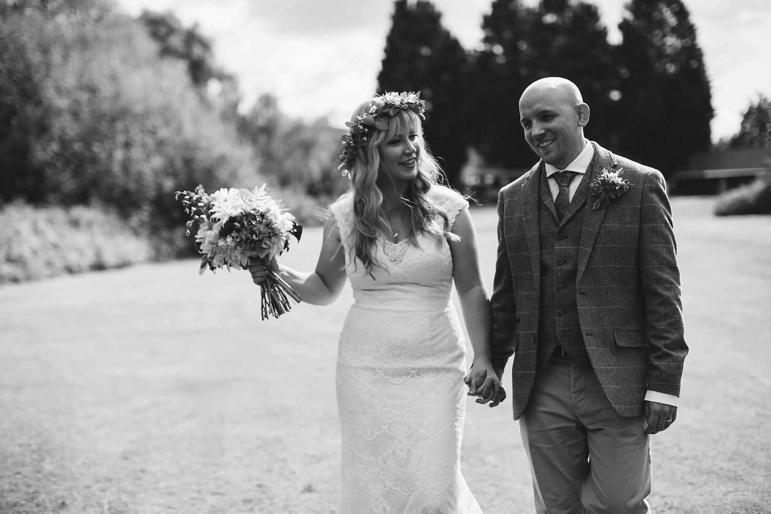 Black and white wedding portraits captured in natural outdoor setting.
