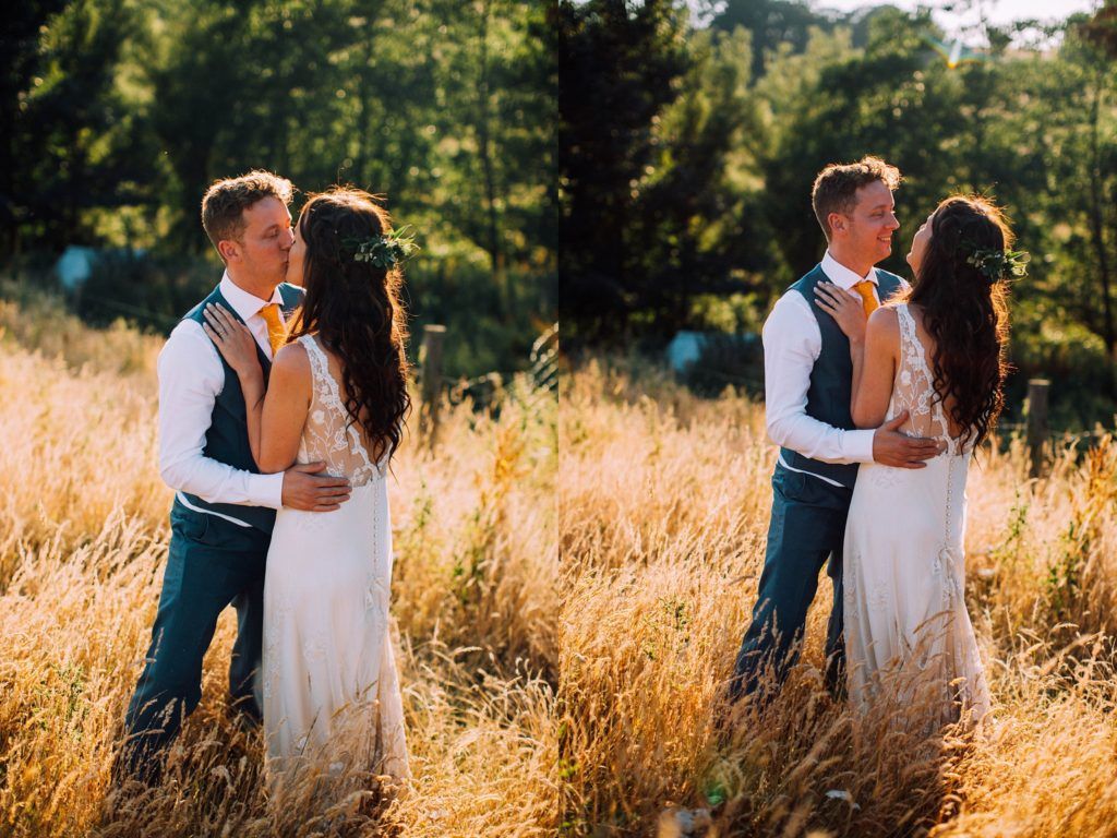 Romantic moments captured in sunlit field with tall golden grass.
