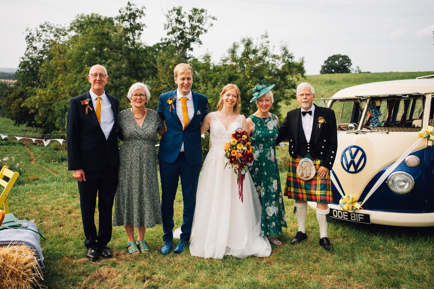 A collage of outdoor wedding celebration photos featuring vintage Volkswagen vans and guests in formal attire.