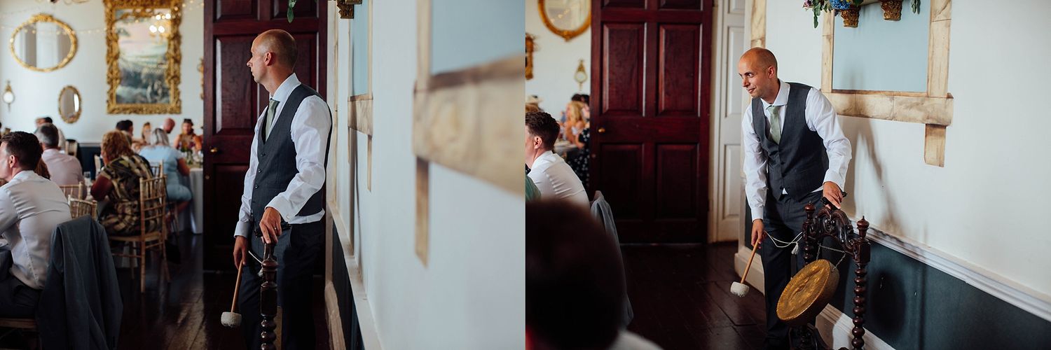 Wedding guests mingle and socialize during a reception in an elegant indoor venue.