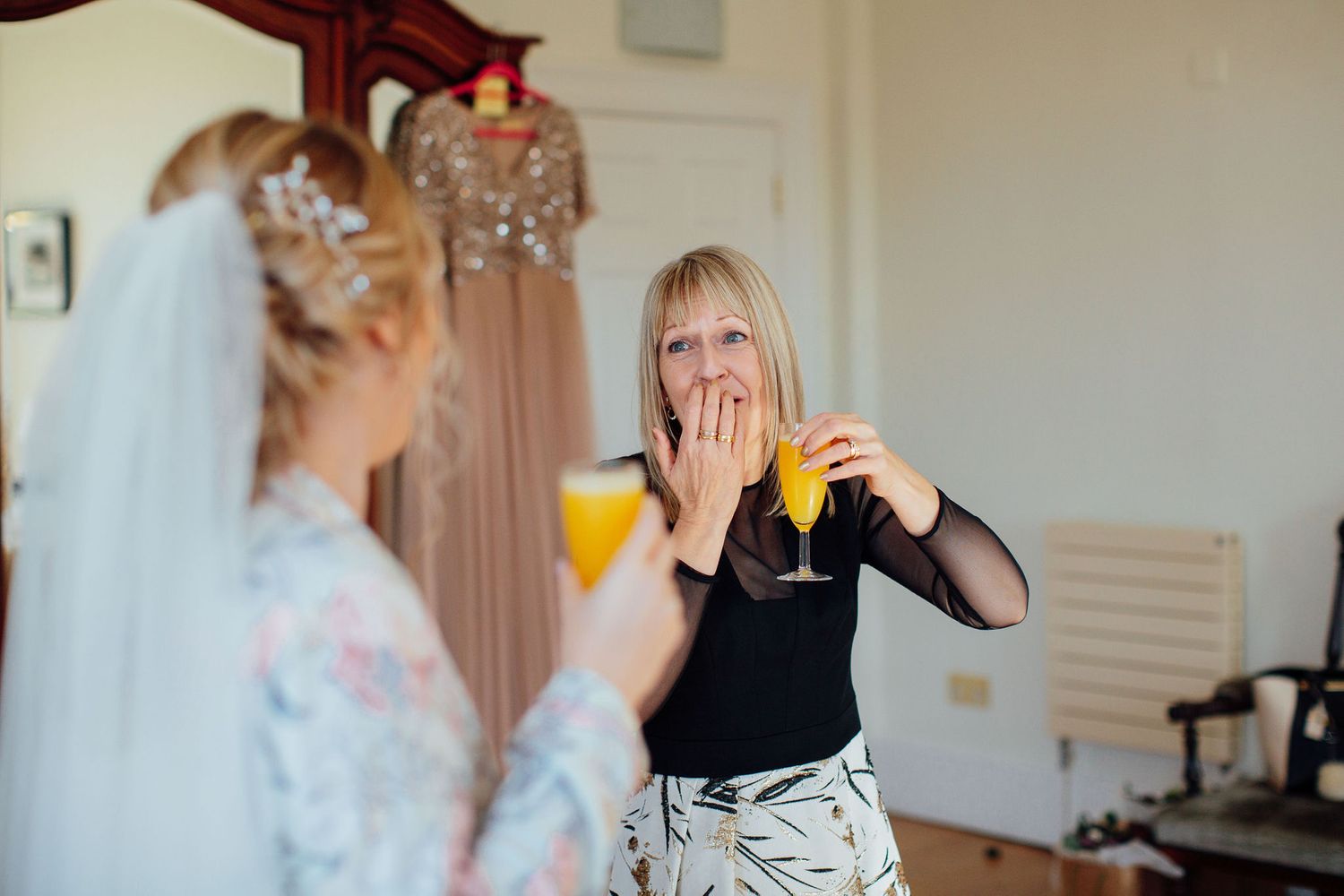 Bridal party sharing joyful moments while getting ready for the wedding.