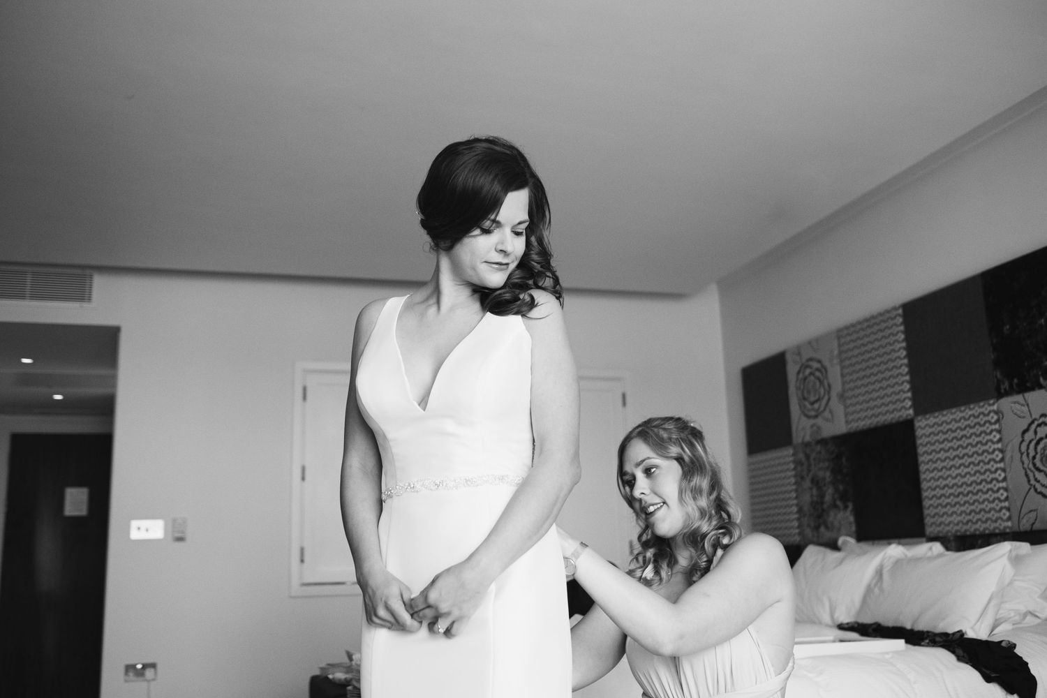 Black and white getting ready moments captured during wedding preparations.