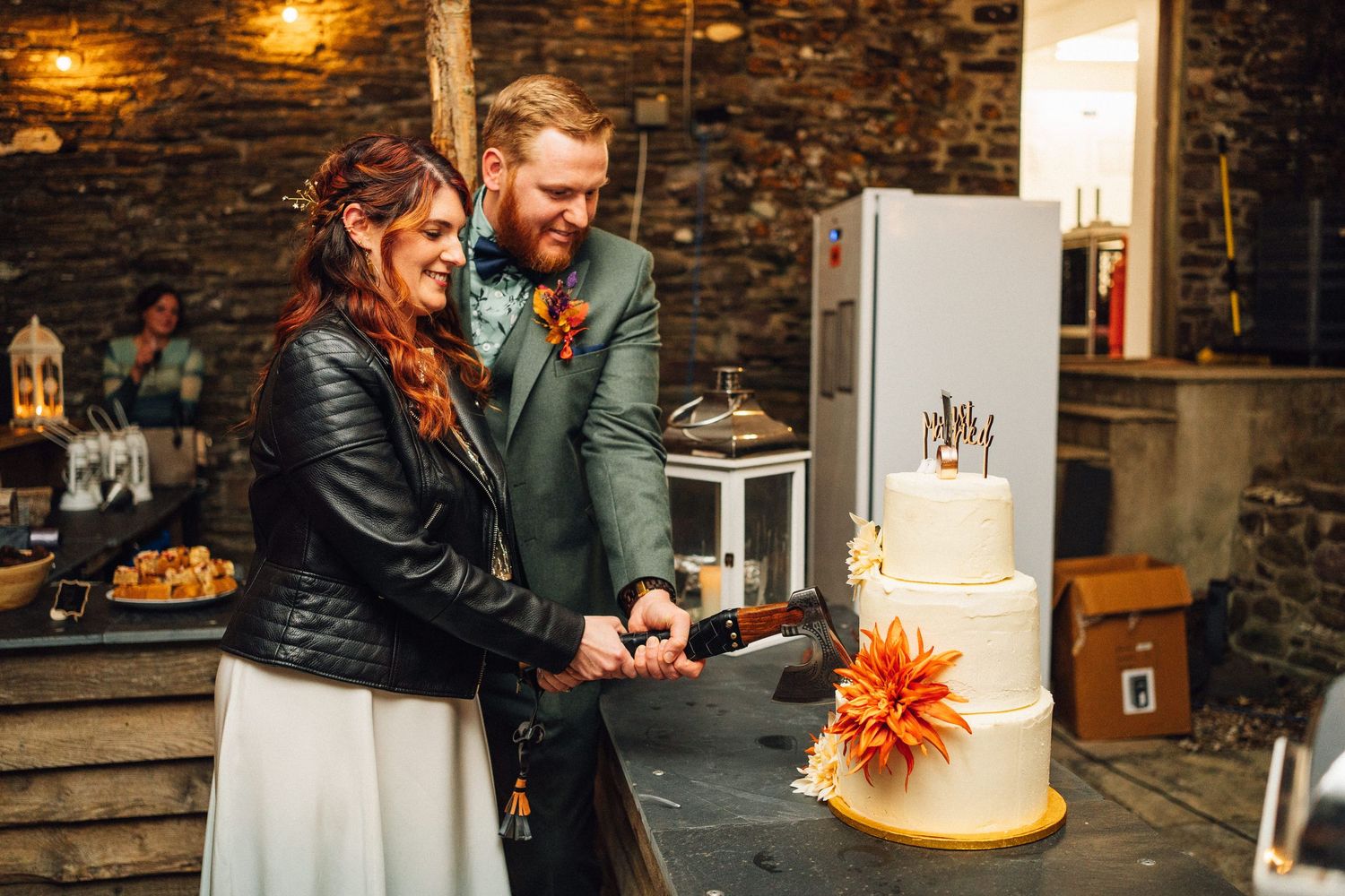 Romantic reception moments captured against rustic stone walls with glowing candles and autumn decor.