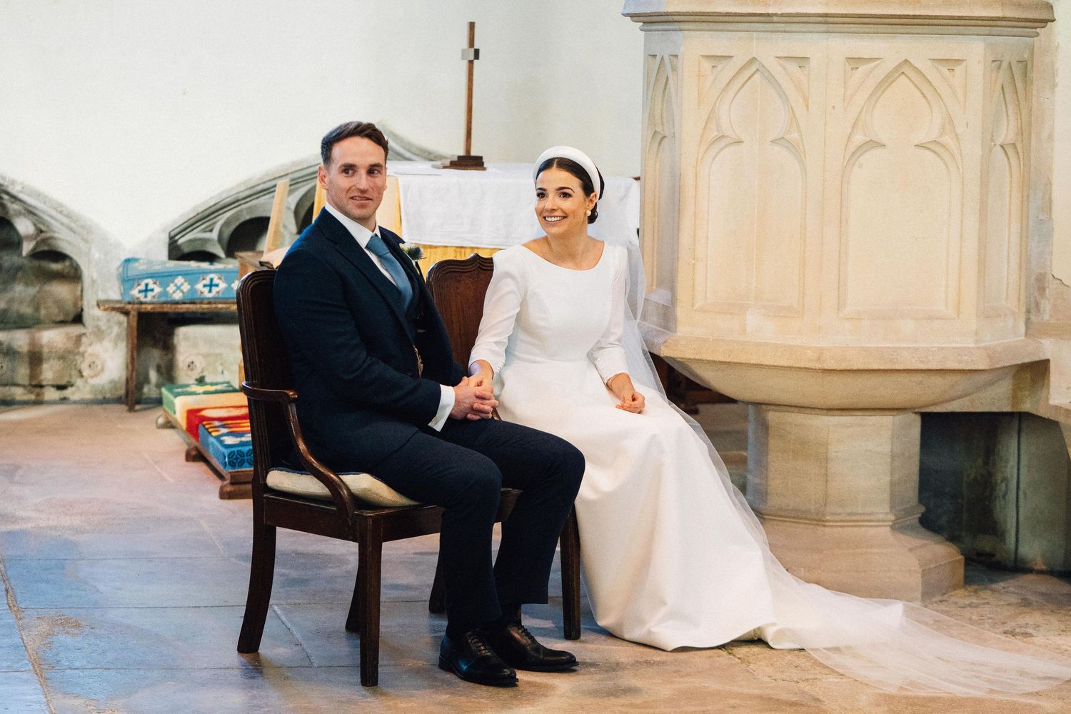 A series of romantic wedding photos showing couples sitting together on ornate stone steps at a church venue.