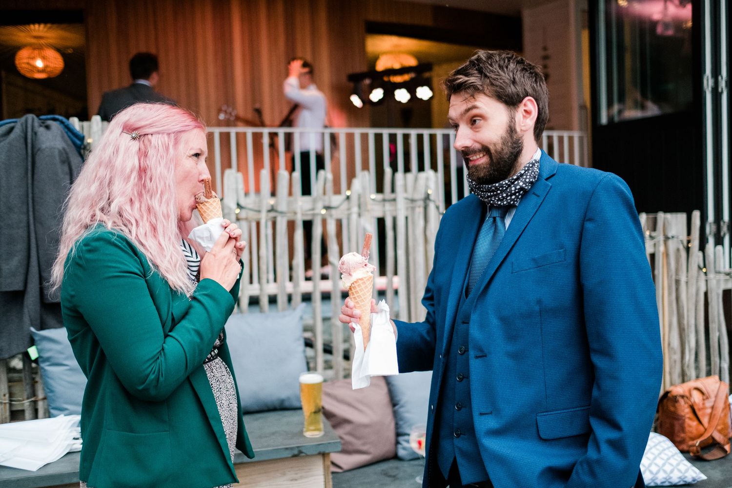 Emotional moments captured between guests during an indoor celebration.