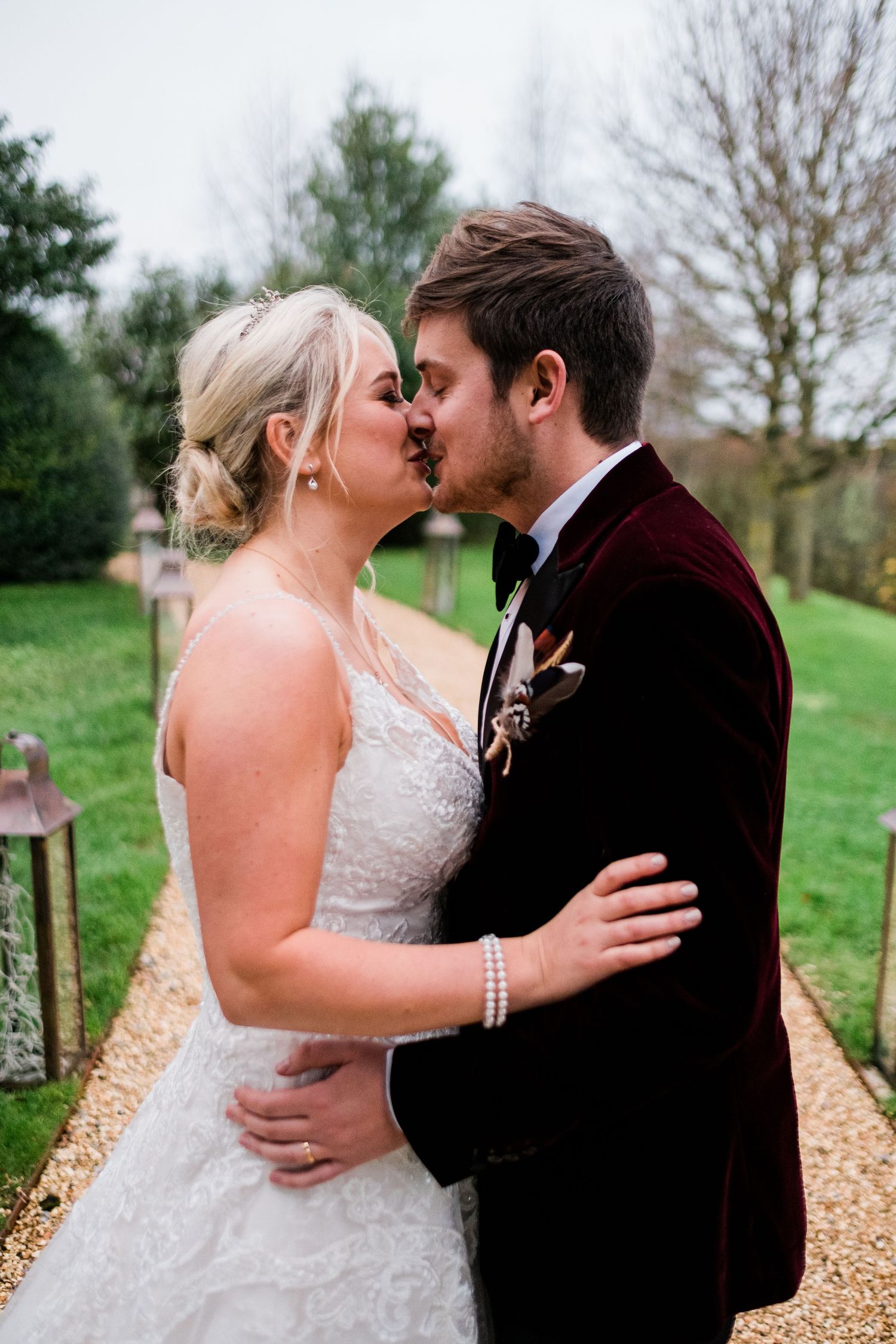 Intimate wedding moments captured in a series of romantic outdoor portraits on a gravel path.