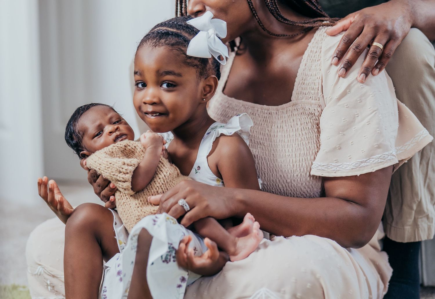 A heartwarming series of candid mother and baby moments featuring tender embraces and joyful interactions.