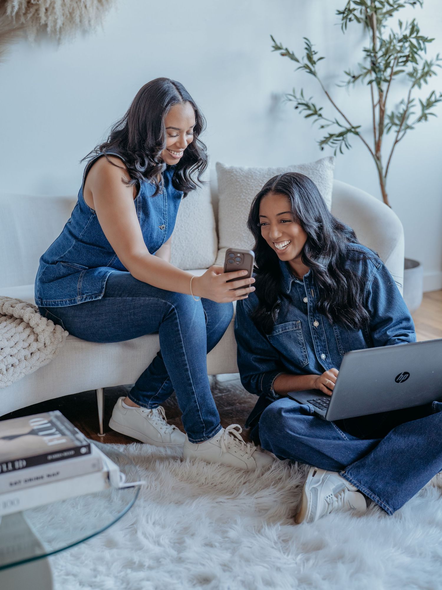 Woman in denim relaxing on white carpet while using laptop and smartphone in five different casual poses.