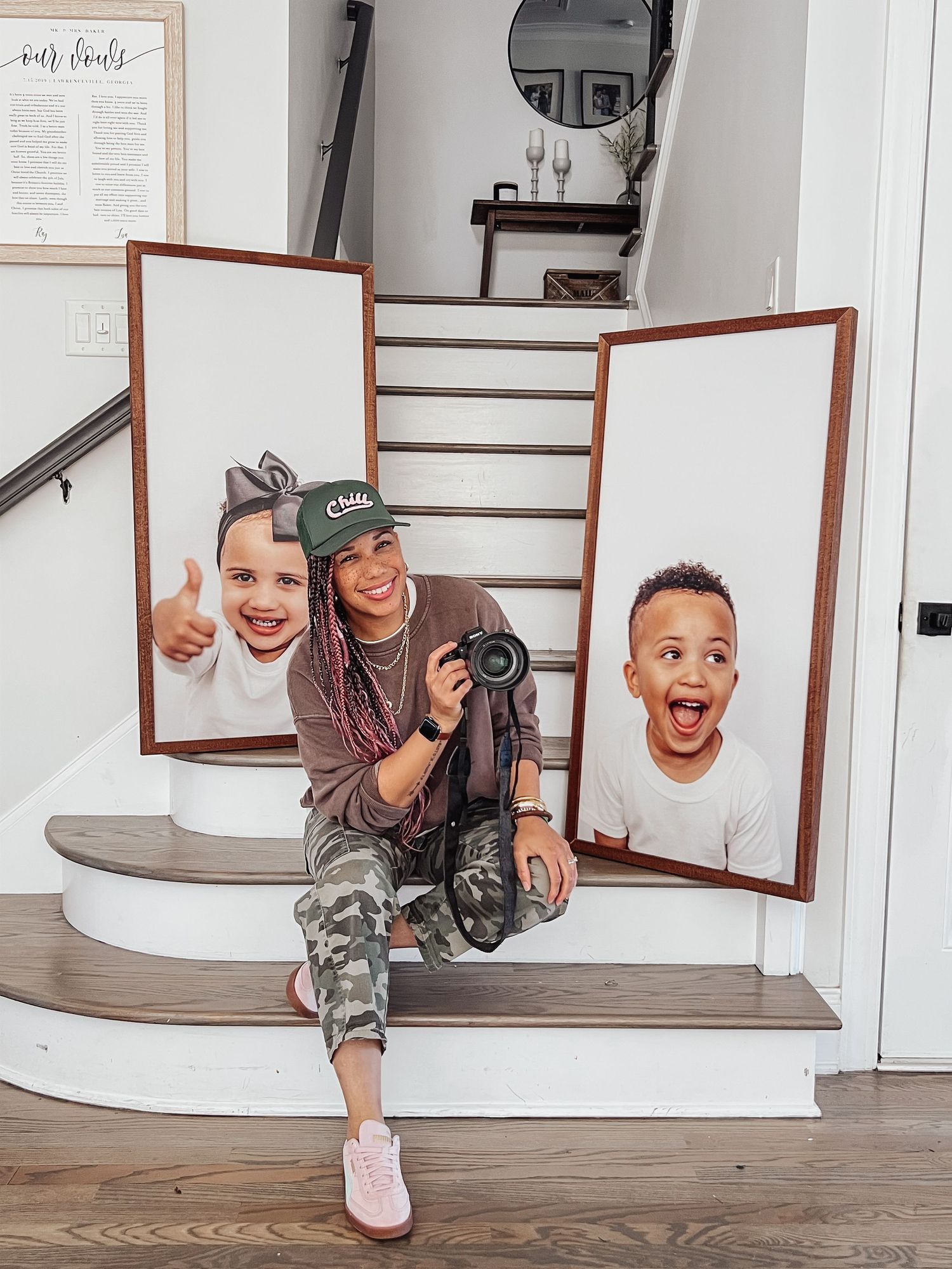 Four sequential photos showing playful poses through a wooden frame mounted on a white wall.