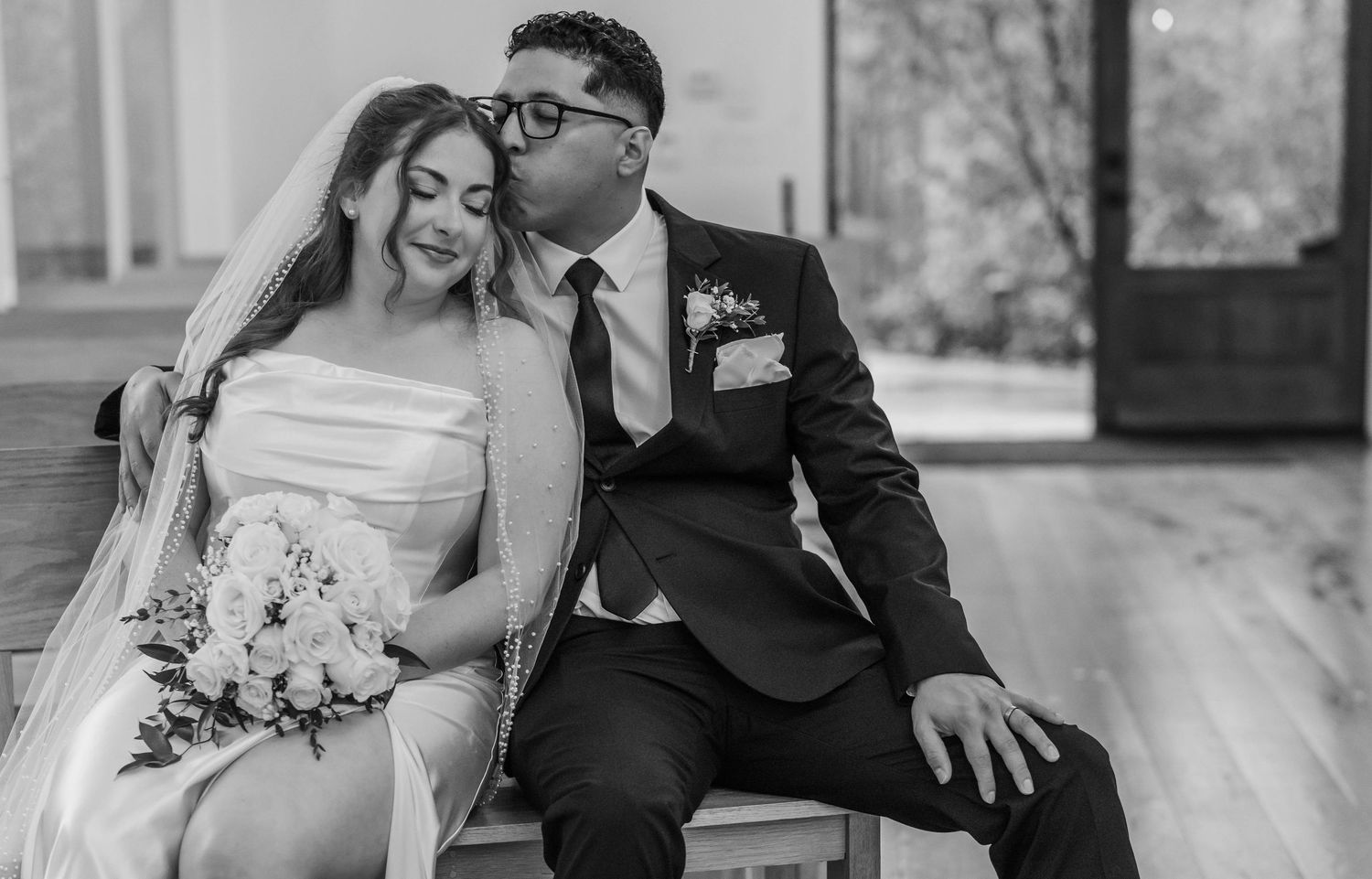 A black and white collage of romantic wedding moments showing couples embracing and sharing intimate moments.