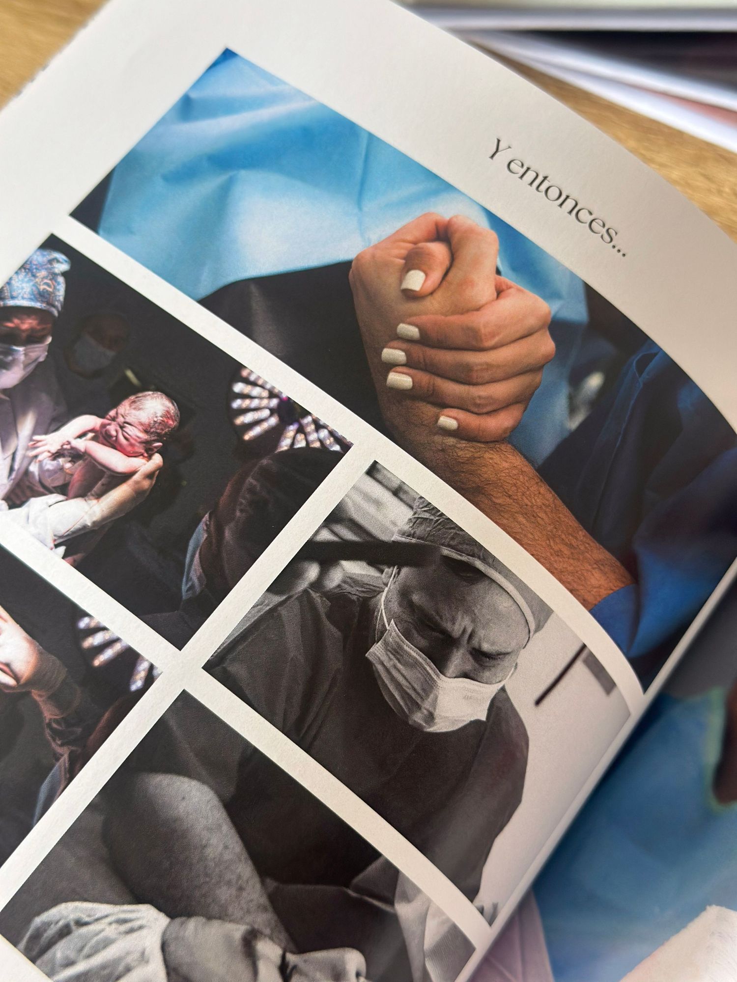 A Spanish-language book open to a page titled Y entonces showing childbirth and medical photos with hands clasped together.