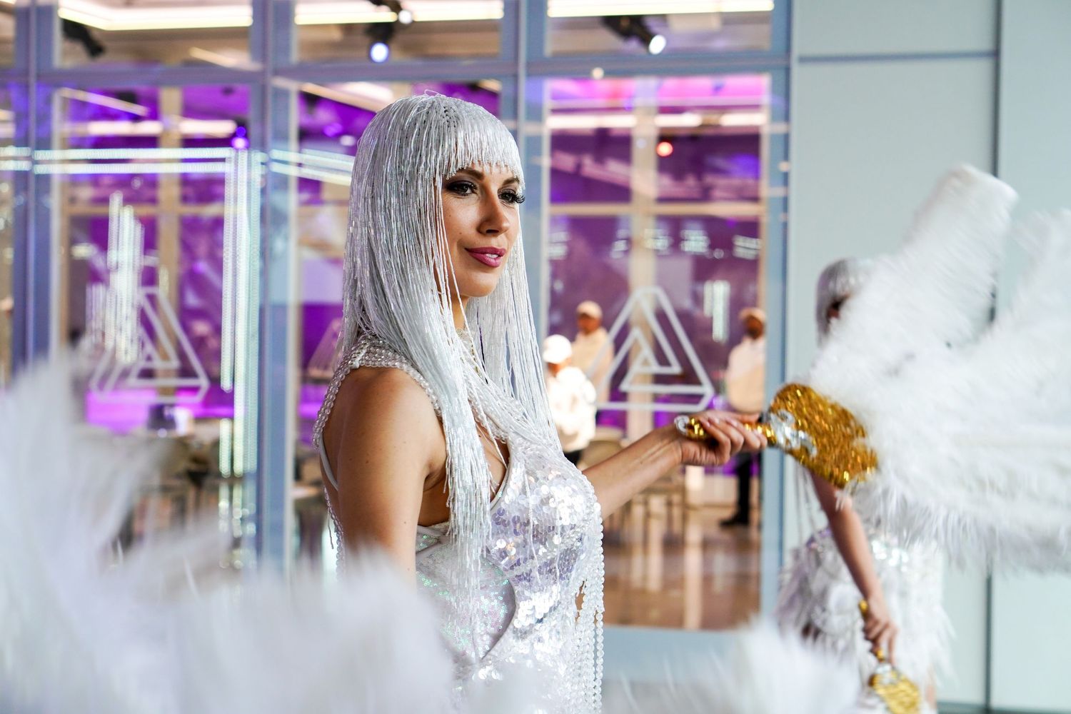 Editorial fashion sequence showing ethereal styling with silver hair and white clothing.