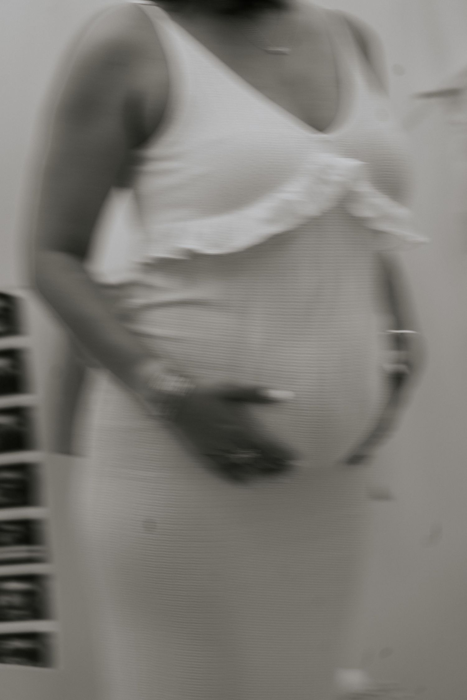 Black and white maternity photography sequence showing growing baby bump.