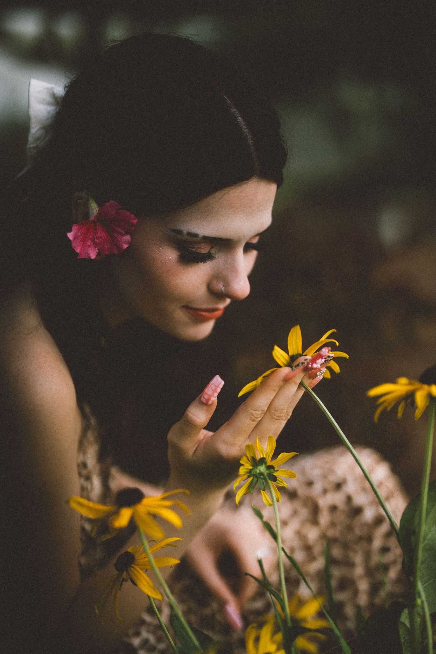 Close-up nature photography with yellow black-eyed susan flowers in soft focus.