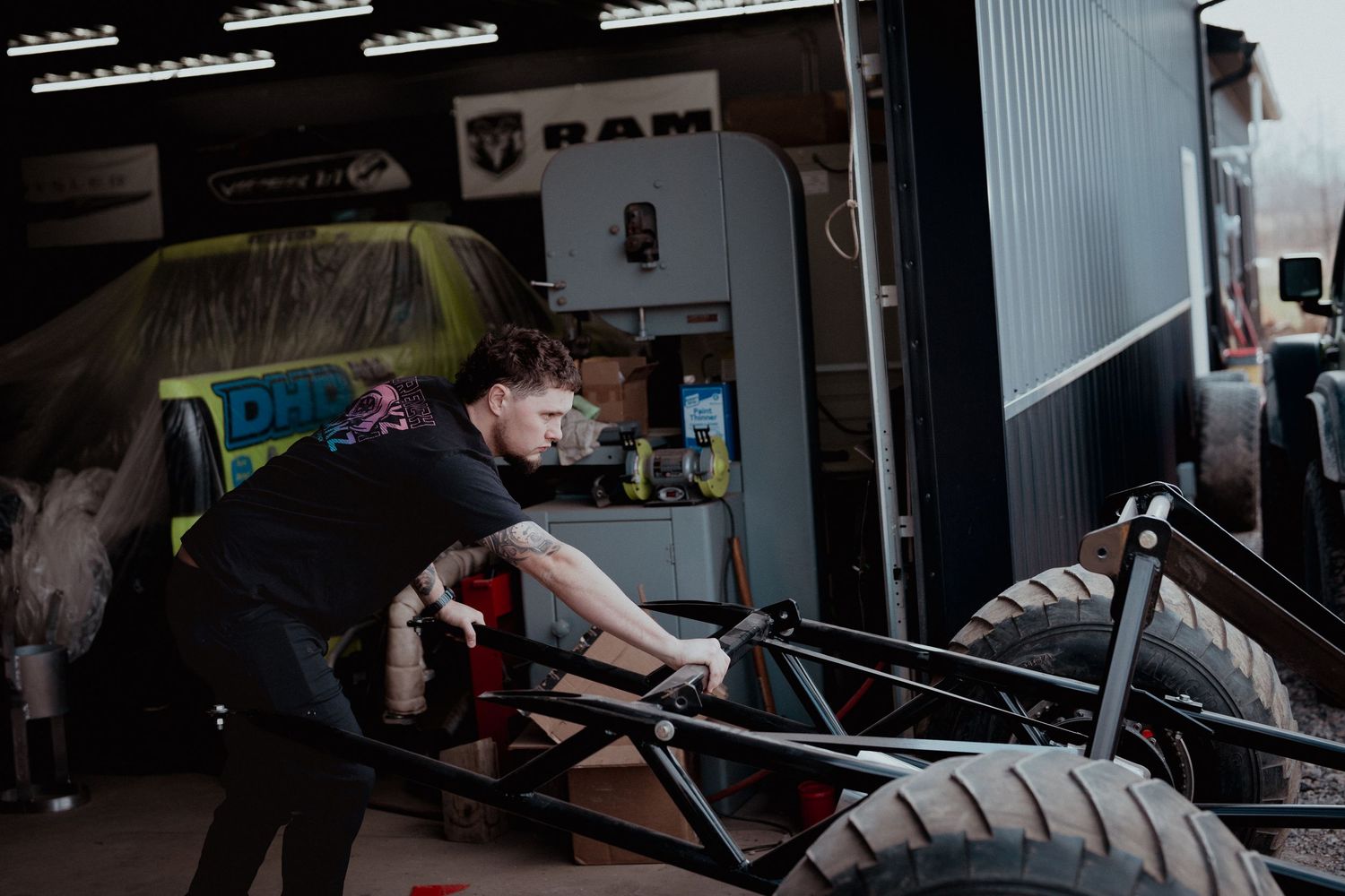 Hands working on truck repair and maintenance in a workshop.