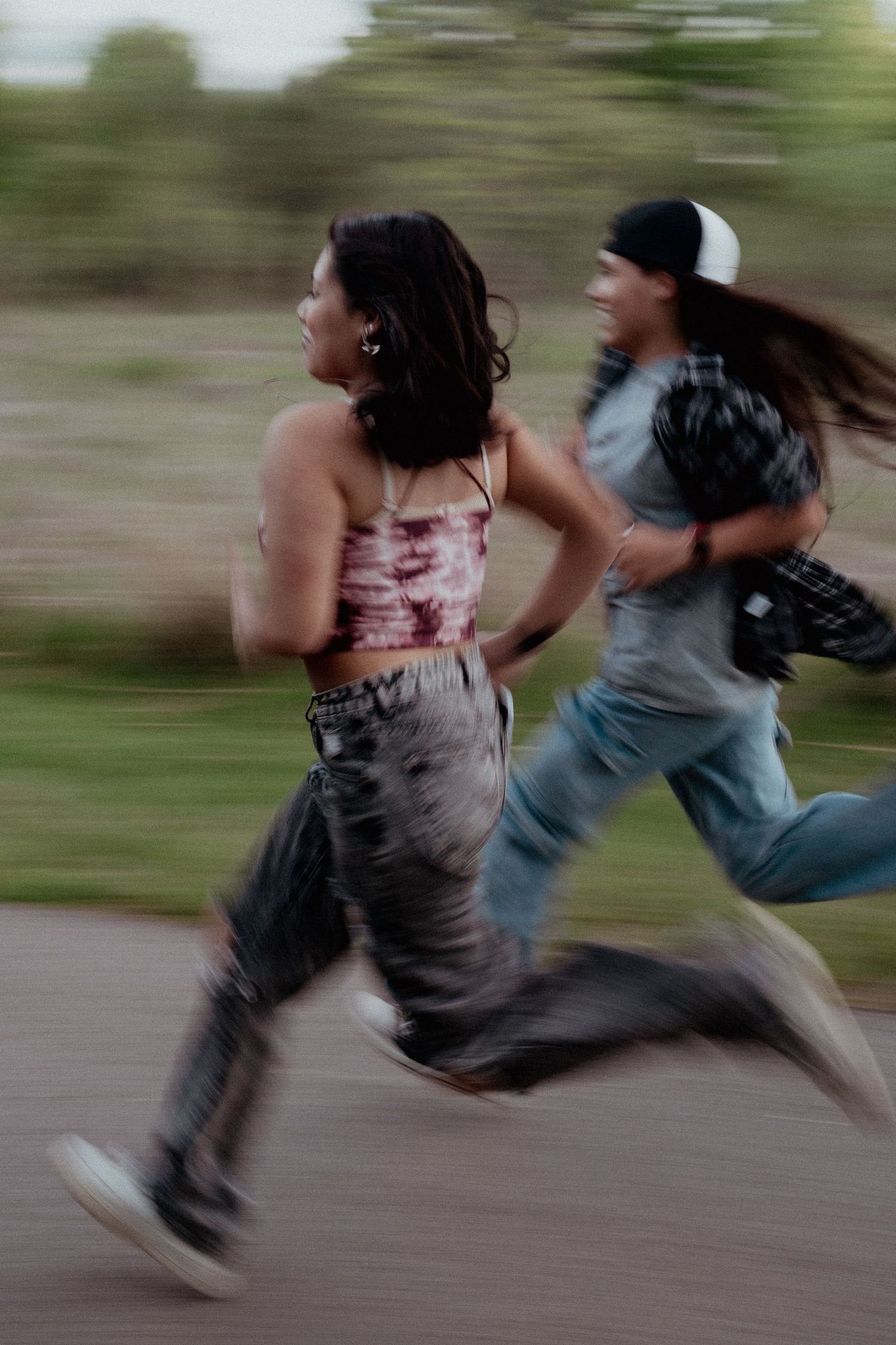 Motion-blurred sequence showing people running or jumping in casual clothes.