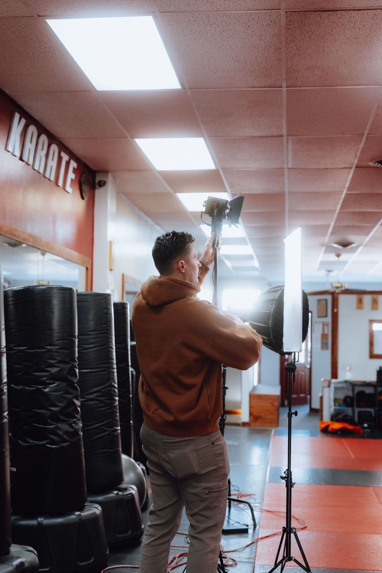 Videographer setting up lights.