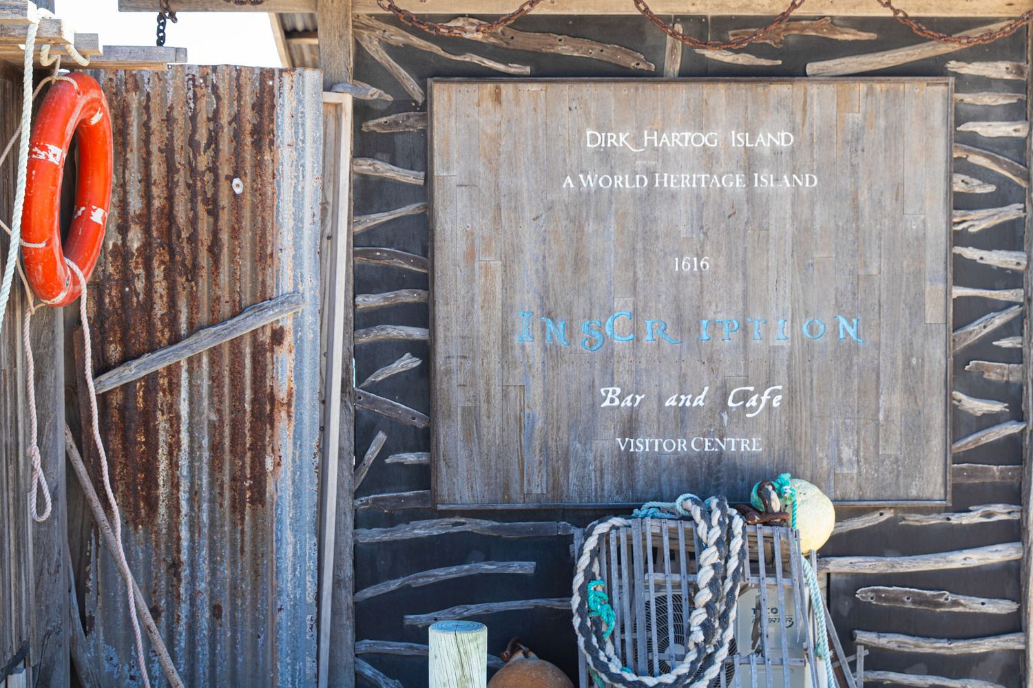 Rustic wooden sign for Dirk Hartog Island World Heritage Anidel Pellan Bar Cafe Visitor Centre.