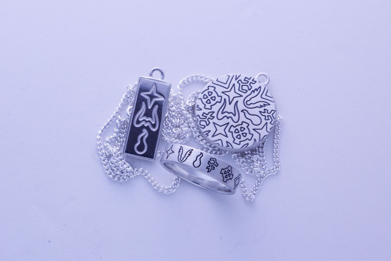 Silver engraved pendant necklace with star and tribal pattern ring jewelry set.