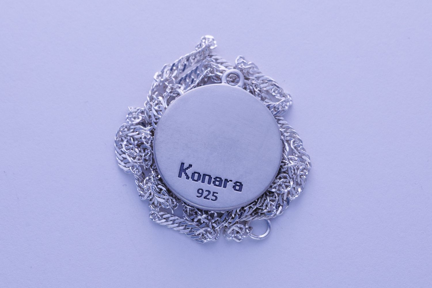 Silver 925 Konara branded round pendant with multi-strand chain jewelry.