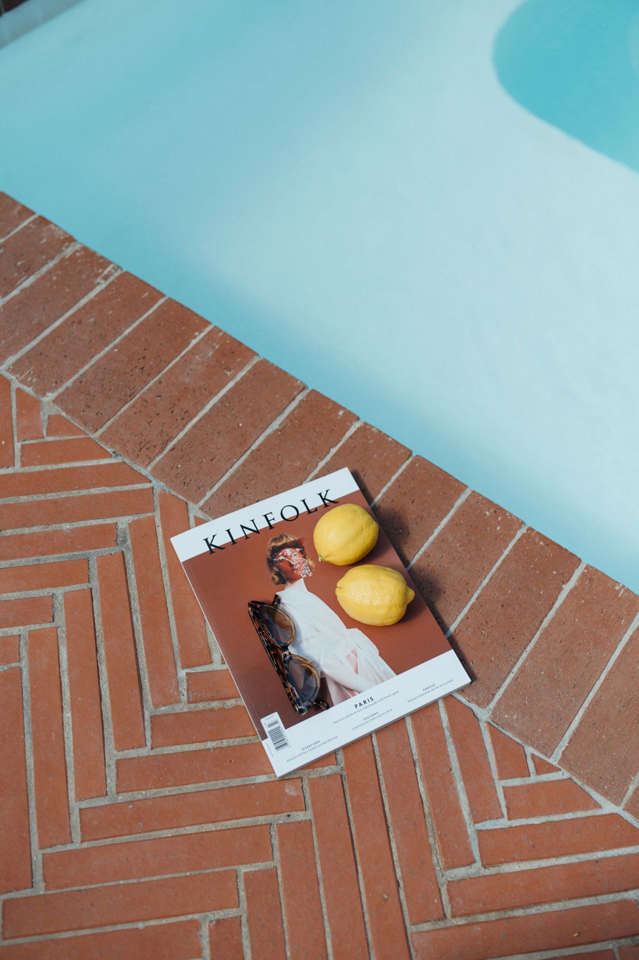 A series of images showing bananas and a paper note arranged in a herringbone pattern on terracotta floor tiles.