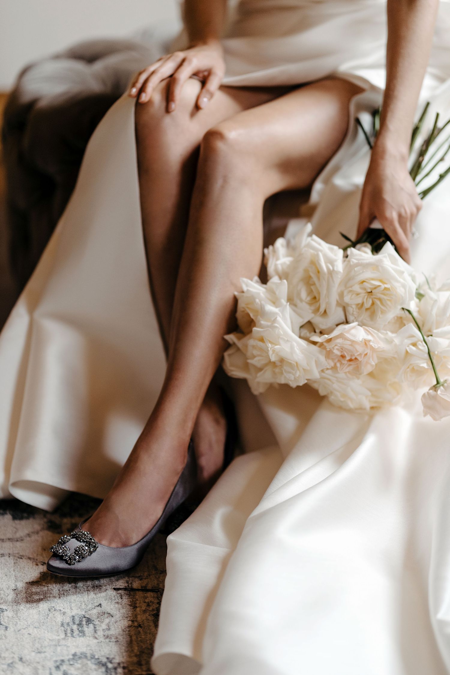 Elegant bridal shoes and white dress details captured in a romantic series of closeup photographs.